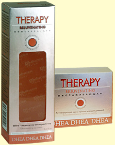 Prezentacja dwóch opakowań kosmetyków 'Therapy Rejuvenating': pionowe, smukłe pudełko obok niskiego, prostokątnego pudełka, oba w kolorystyce brązowo-białej z czerwonymi akcentami i napisem...